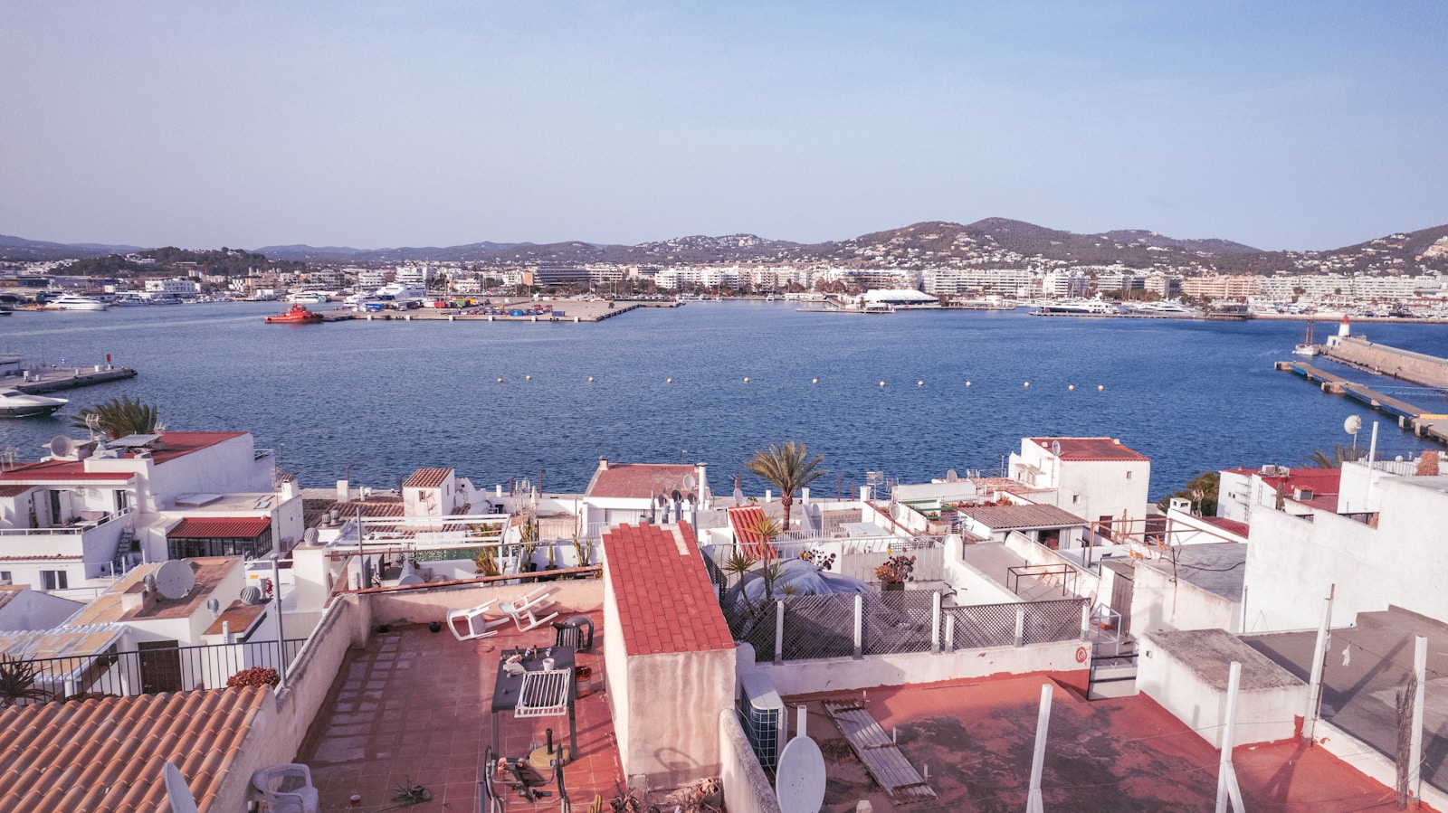 A view of a harbor from a rooftop of a building